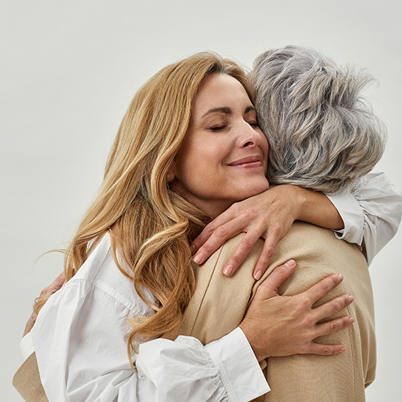 Woman hugging widow