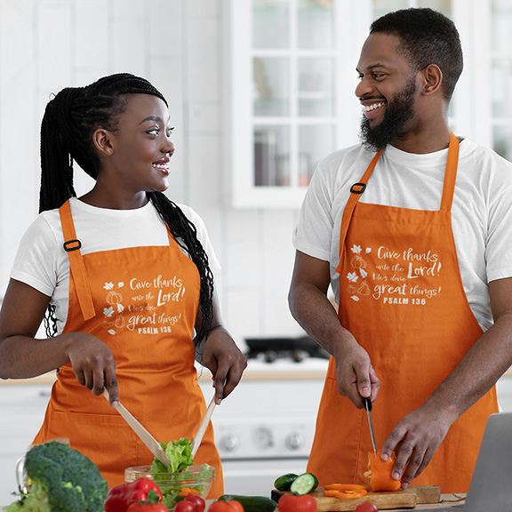 Give Thanks Apron worn by couple in kitchen cooking